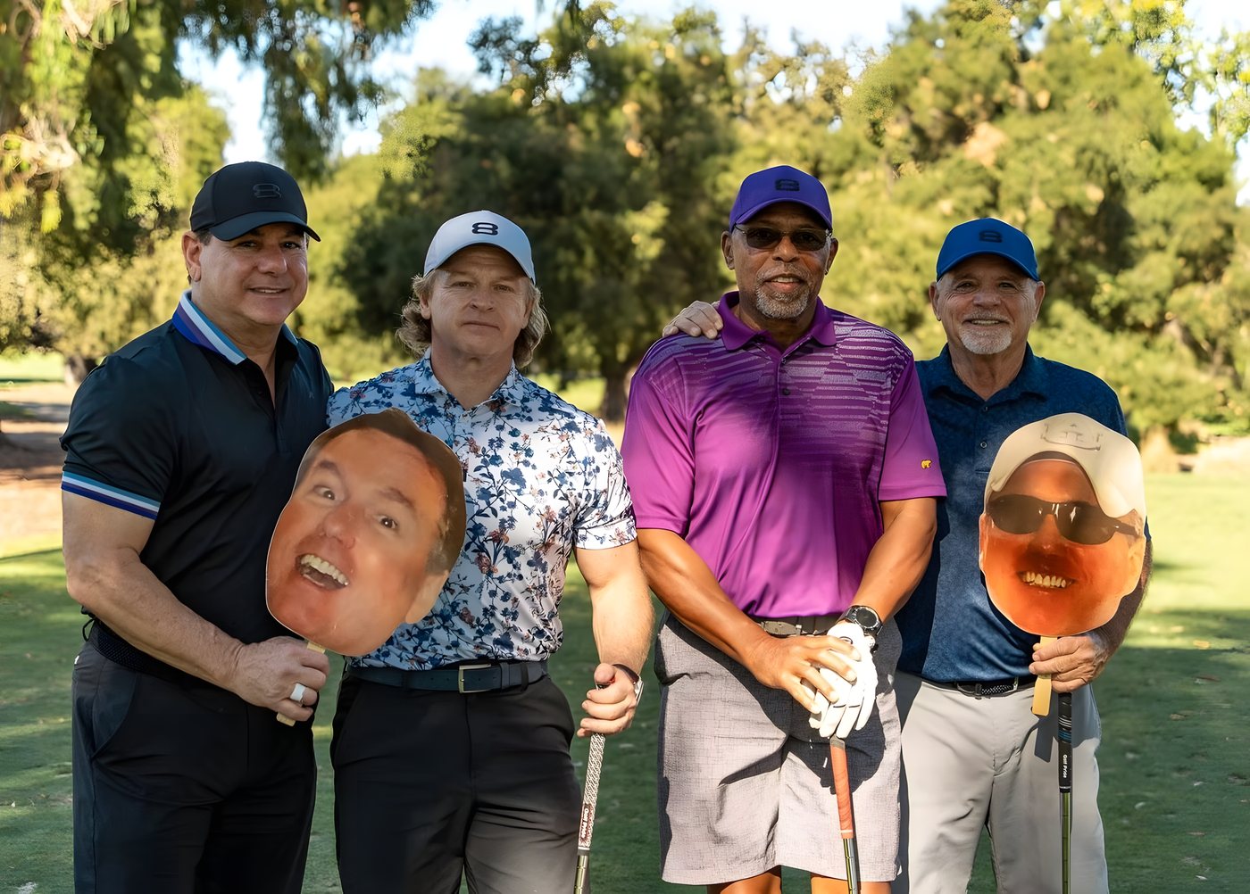 A foursome posing with Kipper cutout faces