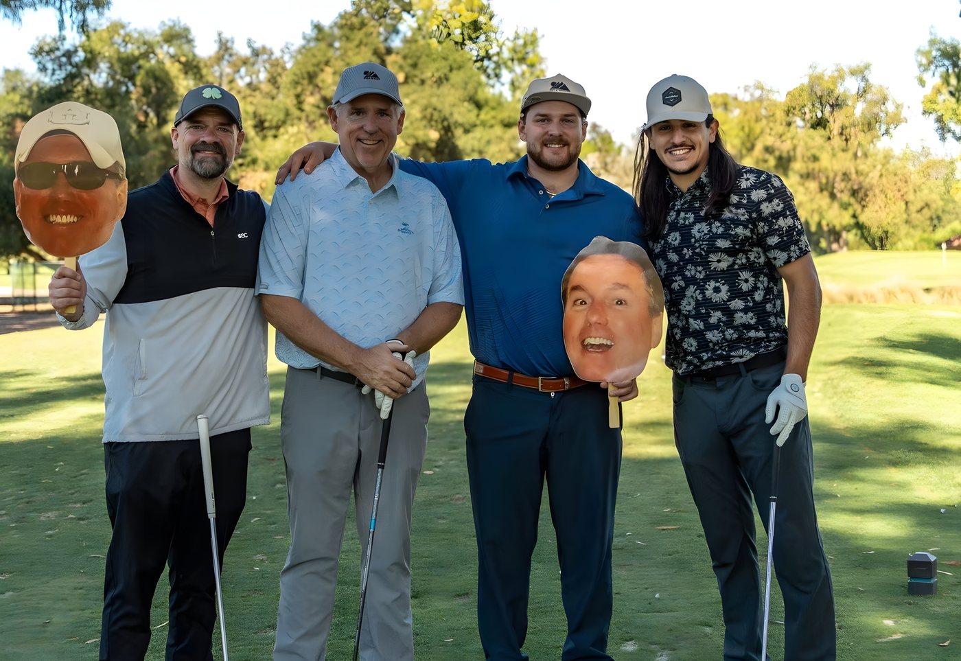 A team posing with Kipper cutouts on the course