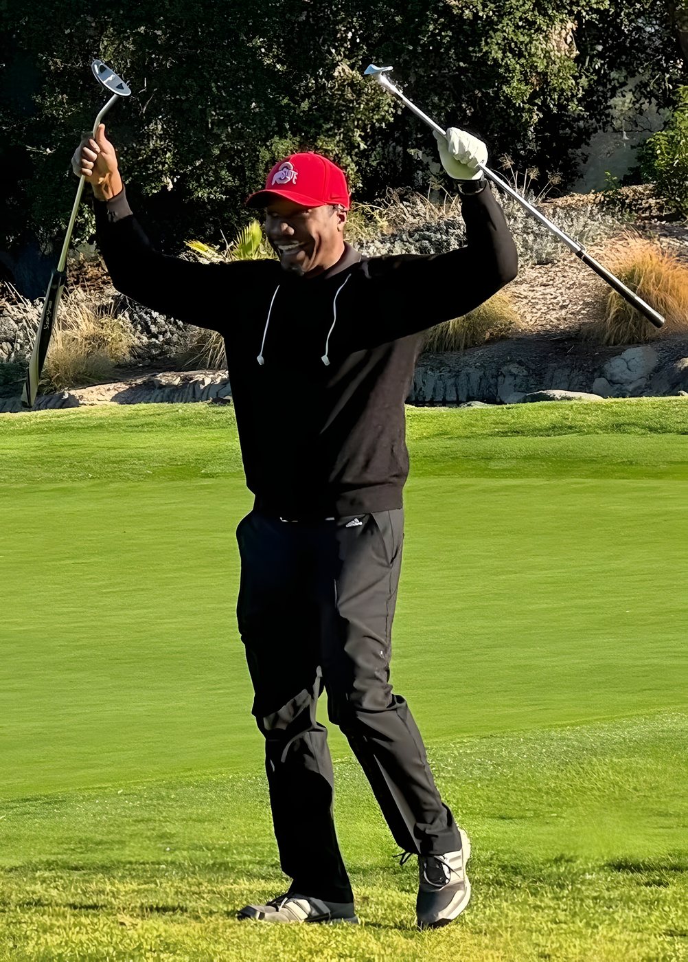 A player finishing his follow-through after a tee shot