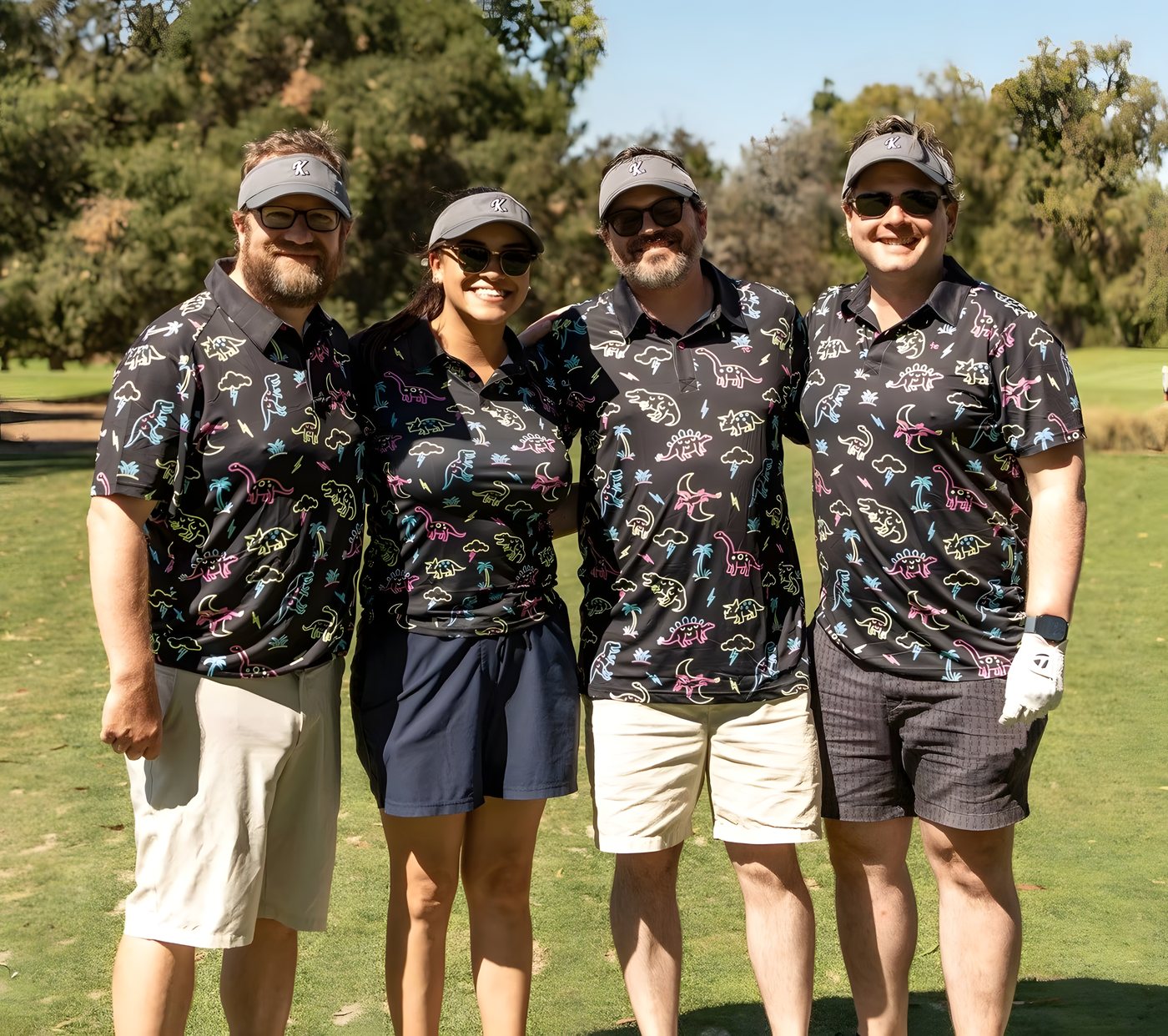 A foursome in matching patterned shirts on the course