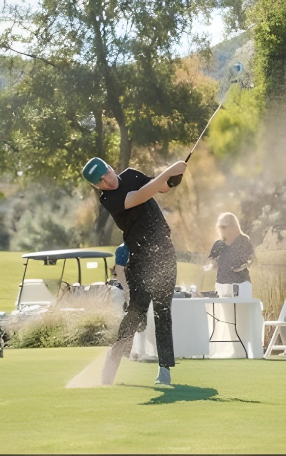 A player blasting out of a greenside bunker
