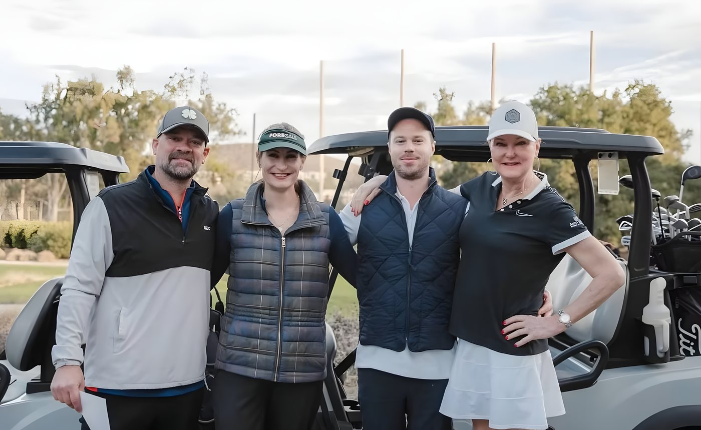 A group posing beside a cart before heading out