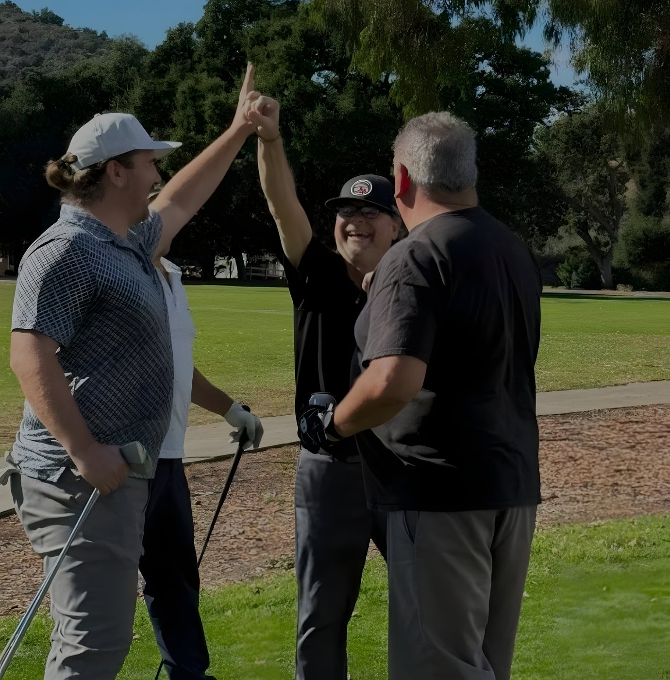 Players celebrating a shot on the course